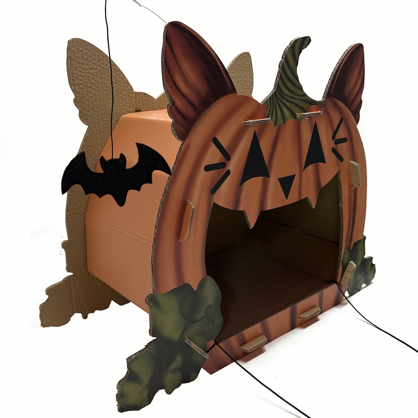 Halloween-themed cardboard cat house with pumpkin design on a white background
