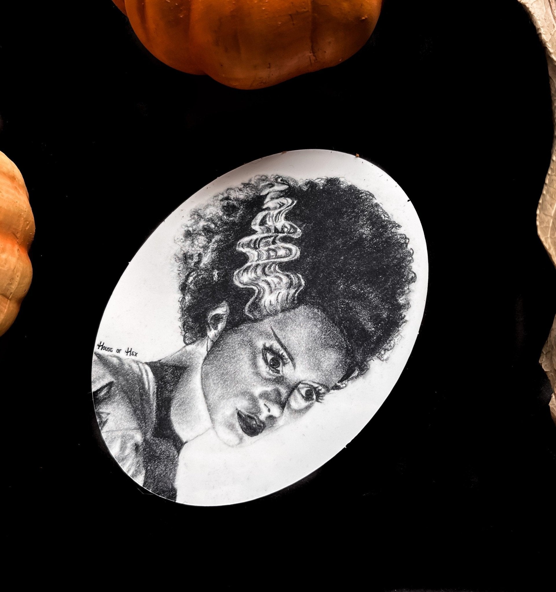 Black and white portrait drawing of the Bride of Frankenstein on a white sticker.
