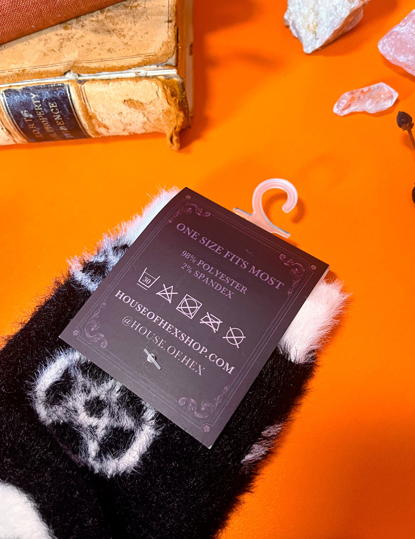 Black fuzzy socks featuring a pattern of pentagrams.