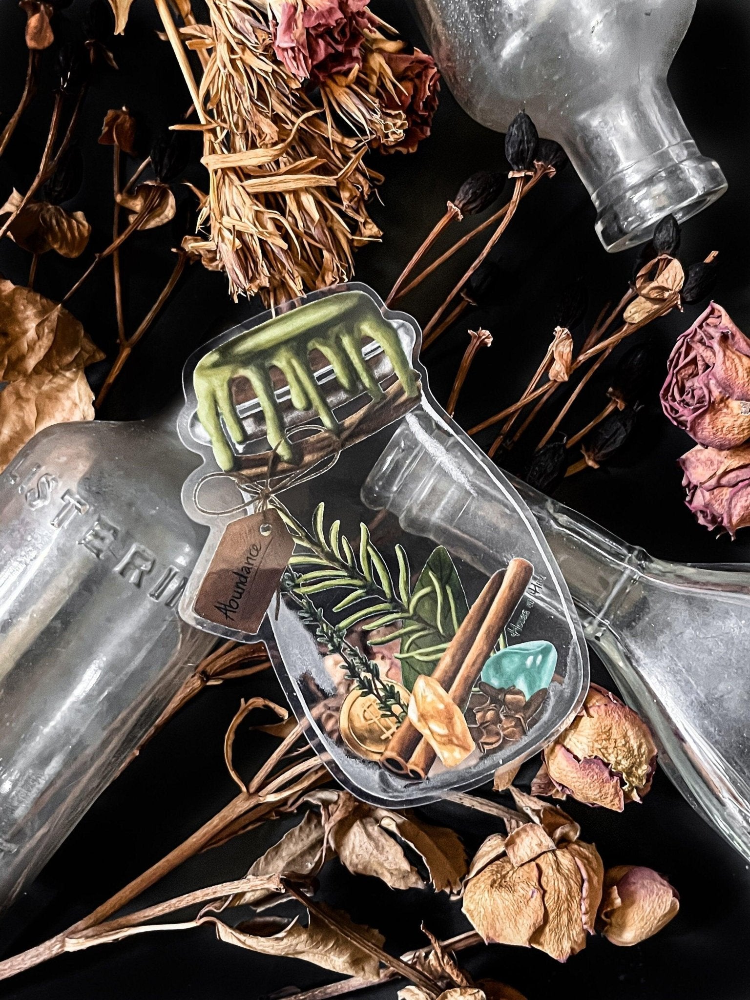 An artistic sticker illustrating a jar of herbs and spices with a tag that says "Abundance".