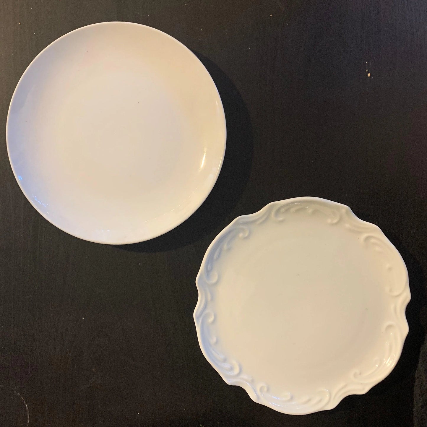 Two white decorative plates.
