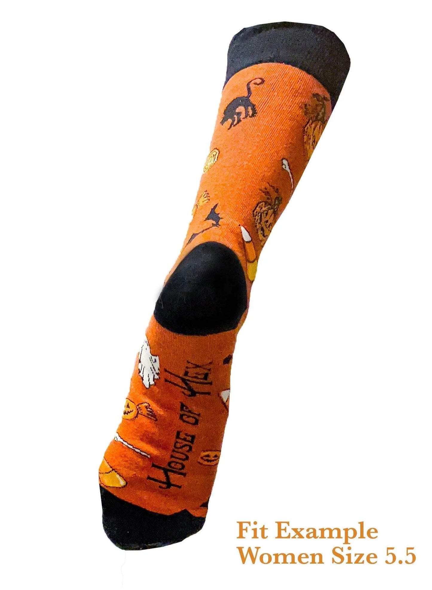 Halloween socks with blacks on the toes, heel, and ankle section featuring a pattern of pumpkins, candy corn, ghosts, bones, and bats.
