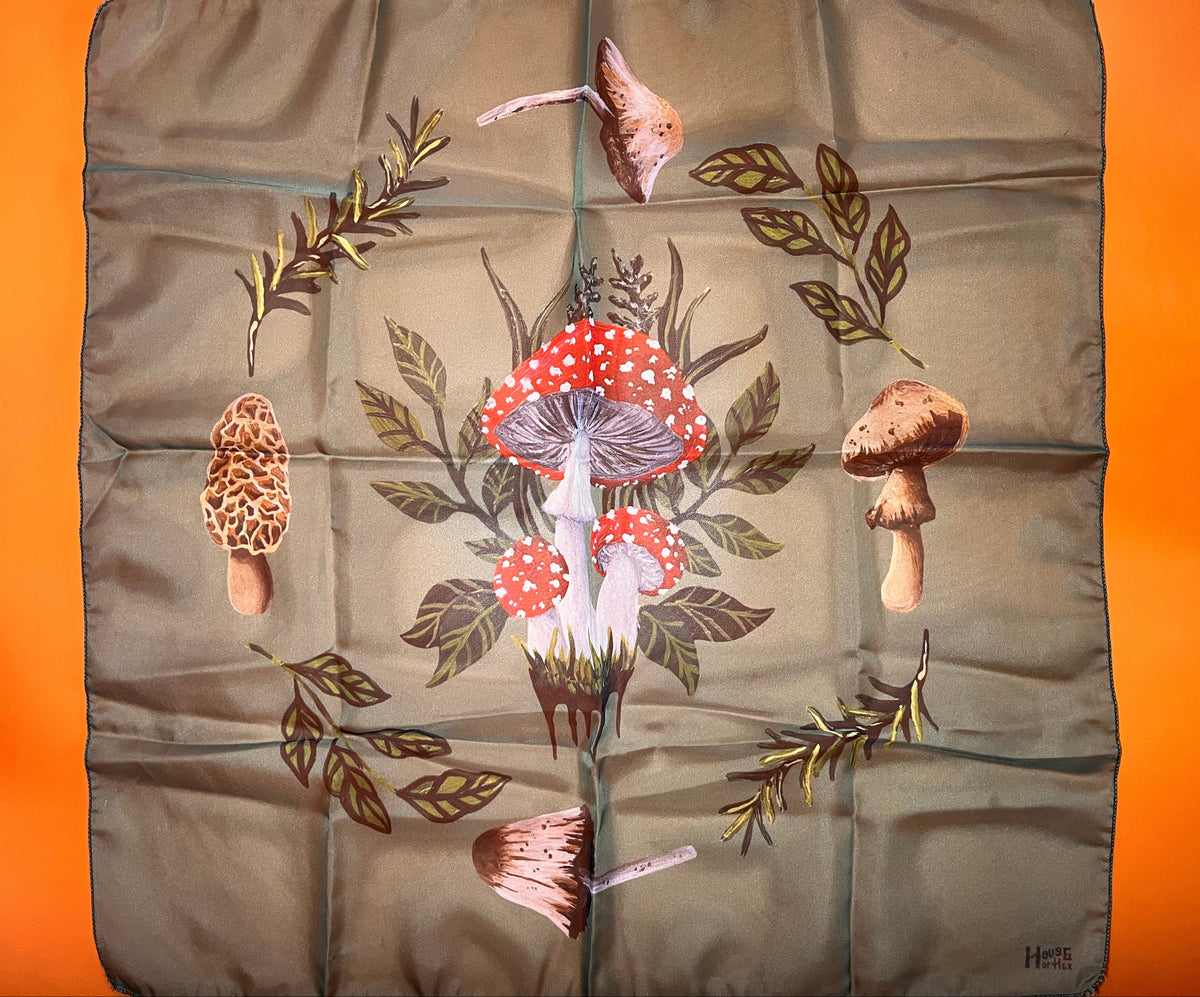 Fabric with mushroom and leaf pattern on a green background